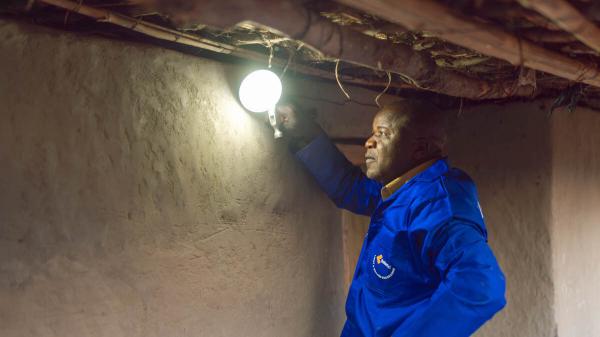 photo of In Malawi, a rural community shines bright with 100% solar power milestone image