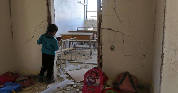 photo of Children help cultivate farmland after bombs image